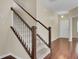 Elegant staircase with dark wood railings and white balusters at 1625 Pimlico Blvd, Moncks Corner, SC 29461