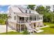 Two-story home with metal roof and large backyard at 2972 Anchor Watch Dr, Wadmalaw Island, SC 29487