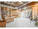 Unfinished basement area with shelving and ample space for storage and workshop at 2972 Anchor Watch Dr, Wadmalaw Island, SC 29487
