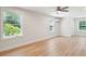Bright, spacious basement room with large windows and light hardwood flooring at 2972 Anchor Watch Dr, Wadmalaw Island, SC 29487