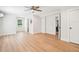 Large basement room with hardwood floors, a ceiling fan, and access to other rooms at 2972 Anchor Watch Dr, Wadmalaw Island, SC 29487