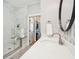 Bathroom with a walk-in shower, marble tile, and access to closet at 2972 Anchor Watch Dr, Wadmalaw Island, SC 29487
