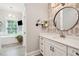 Bathroom boasts white vanity, quartz countertop, and patterned wallpaper at 2972 Anchor Watch Dr, Wadmalaw Island, SC 29487