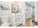 White vanity with quartz countertop and built in shelving at 2972 Anchor Watch Dr, Wadmalaw Island, SC 29487