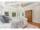 Primary bedroom with hardwood floors, beamed ceiling, and ample closet space at 2972 Anchor Watch Dr, Wadmalaw Island, SC 29487