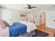 Serene bedroom featuring hardwood floors and a charming blue quilt at 2972 Anchor Watch Dr, Wadmalaw Island, SC 29487