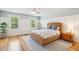Bright bedroom with wicker bed frame and wood floors at 2972 Anchor Watch Dr, Wadmalaw Island, SC 29487