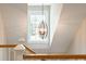 Modern chandelier illuminating a staircase at 2972 Anchor Watch Dr, Wadmalaw Island, SC 29487