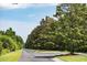 Long tree-lined road in the community at 2972 Anchor Watch Dr, Wadmalaw Island, SC 29487