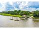 Wooden community dock extending into the river at 2972 Anchor Watch Dr, Wadmalaw Island, SC 29487