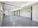 Bright and spacious garage interior with epoxy flooring at 2972 Anchor Watch Dr, Wadmalaw Island, SC 29487