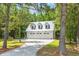 Detached three-car garage with metal roof at 2972 Anchor Watch Dr, Wadmalaw Island, SC 29487