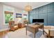 Home office with hardwood floors, stylish wall paneling, and two work stations at 2972 Anchor Watch Dr, Wadmalaw Island, SC 29487
