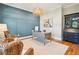 Bright home office featuring built-in shelving and hardwood floors at 2972 Anchor Watch Dr, Wadmalaw Island, SC 29487