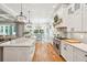 Modern kitchen with white cabinets and a spacious island at 2972 Anchor Watch Dr, Wadmalaw Island, SC 29487
