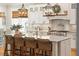 Modern kitchen with white cabinets, large island, and stylish lighting at 2972 Anchor Watch Dr, Wadmalaw Island, SC 29487
