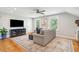 Cozy living room with sectional sofa and hardwood floors at 2972 Anchor Watch Dr, Wadmalaw Island, SC 29487