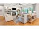 Living room with fireplace, built-in shelving, and hardwood floors at 2972 Anchor Watch Dr, Wadmalaw Island, SC 29487