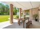 Covered patio with brick columns and wooden table at 2972 Anchor Watch Dr, Wadmalaw Island, SC 29487