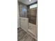 Bathroom with walk-in shower, gray tile, and a built-in seat at 392 Dike Rd, Bonneau, SC 29431