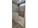 Bathroom with walk-in shower, gray tile, and a built-in seat at 392 Dike Rd, Bonneau, SC 29431