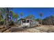 Gray manufactured home with front porch and steps, situated on a wooded lot at 392 Dike Rd, Bonneau, SC 29431