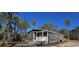 Gray manufactured home with front porch and steps, situated on a wooded lot at 392 Dike Rd, Bonneau, SC 29431