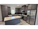 Modern kitchen with gray cabinets, stainless steel appliances, and an island at 392 Dike Rd, Bonneau, SC 29431