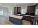 Modern kitchen with gray cabinets, stainless steel appliances, and an island at 392 Dike Rd, Bonneau, SC 29431