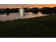 Beautiful pond with fountain and stunning sunset reflecting on the water at 506 Tranquil Waters Way, Summerville, SC 29486