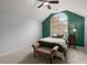 Bright bedroom with green accent wall and large window with fall view at 1005 Shinnecock Hills Ct, Summerville, SC 29483