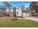 Side view of charming two-story house with a spacious yard at 1005 Shinnecock Hills Ct, Summerville, SC 29483