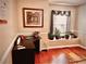 Sunlit home office with hardwood floors, window seat, and corner desk at 1005 Shinnecock Hills Ct, Summerville, SC 29483