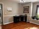 Bright home office features hardwood floors, built-in window seat, and corner desk at 1005 Shinnecock Hills Ct, Summerville, SC 29483