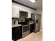 Modern kitchen featuring stainless steel appliances and dark cabinets at 1005 Shinnecock Hills Ct, Summerville, SC 29483