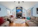 Living room with fireplace, hardwood floors, and plenty of natural light at 1005 Shinnecock Hills Ct, Summerville, SC 29483