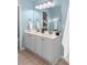 Double vanity bathroom with light gray cabinets and tile floor at 1005 Washitonia # C, Charleston, SC 29492