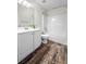 Clean bathroom with white vanity, shower/tub combo, and wood-look floors at 1005 Washitonia # C, Charleston, SC 29492