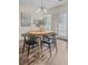 Elegant dining room featuring a wood table and black chairs at 1005 Washitonia # C, Charleston, SC 29492