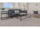 Cozy living area with gray sofa and carpeted floor at 1005 Washitonia # C, Charleston, SC 29492