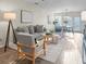 Open living room showcasing neutral decor and hardwood floors at 1005 Washitonia # C, Charleston, SC 29492