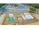 Aerial view of community with pool, playground, and tennis courts at 1016 Swamp Harrier Ave, Ravenel, SC 29470