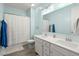 Bathroom with double vanity, shower, and white cabinets at 1016 Swamp Harrier Ave, Ravenel, SC 29470