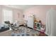 Bedroom featuring a crib, dresser, and rocking chair at 1016 Swamp Harrier Ave, Ravenel, SC 29470