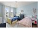 Two twin beds in a shared bedroom with light blue walls at 1016 Swamp Harrier Ave, Ravenel, SC 29470