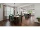 Dining room with kitchen view and hardwood floors at 1016 Swamp Harrier Ave, Ravenel, SC 29470