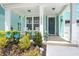 Inviting front porch with rocking chairs and landscaping at 1016 Swamp Harrier Ave, Ravenel, SC 29470