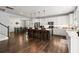 Open kitchen with large island, hardwood floors, and stainless steel appliances at 1016 Swamp Harrier Ave, Ravenel, SC 29470