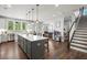 Spacious kitchen with island, stainless steel appliances, and white cabinets at 1016 Swamp Harrier Ave, Ravenel, SC 29470