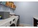 Laundry room with washer, dryer, and shelving at 1016 Swamp Harrier Ave, Ravenel, SC 29470